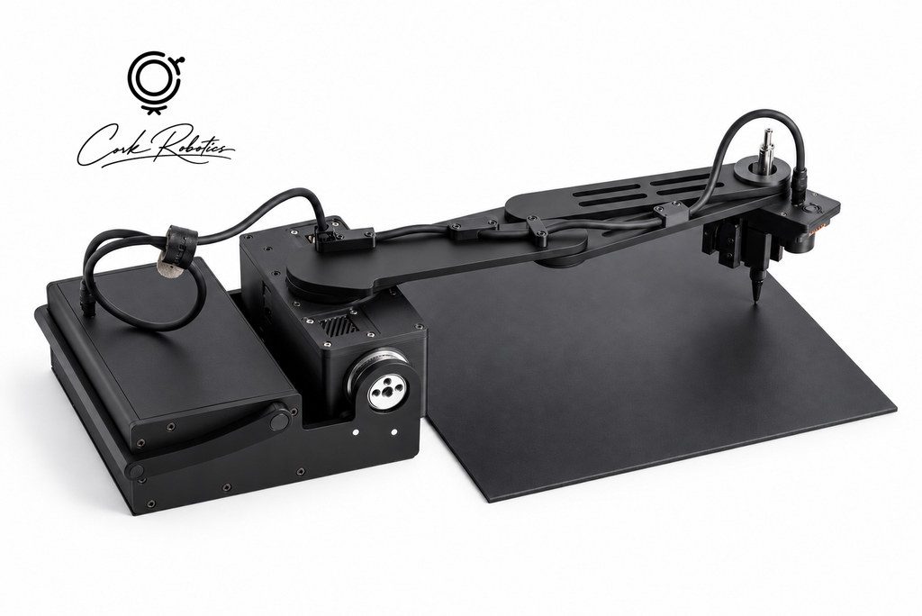 CorkBot with its pen arm extended over a black work mat